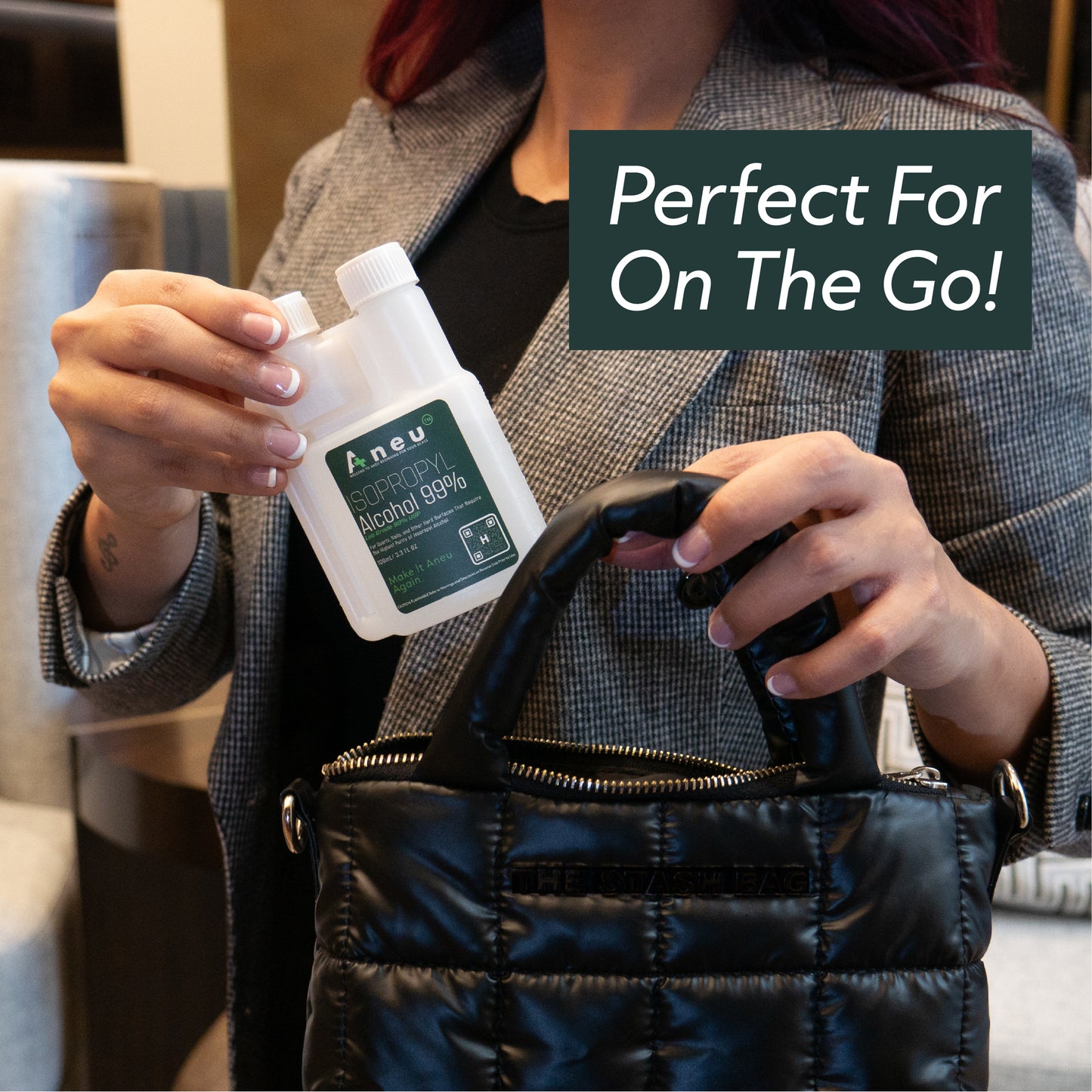 Person holding a small isopropyl 99% alcohol bottle labeled 'Aneu' with text 'Perfect For On The Go!' above.